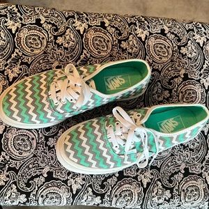 Teal, grey and white Vans.